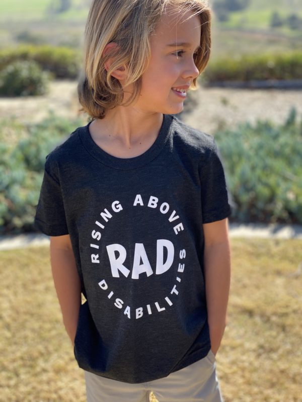 Little boy wearing black shirt with RAD camp logo
