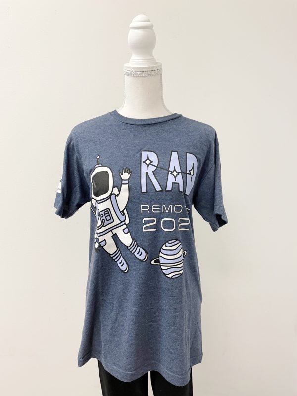 The front of a heather blue shirt. There is a cartoon astronaut waving and a planet. The words RAD Remote 2020 are written on the shirt.