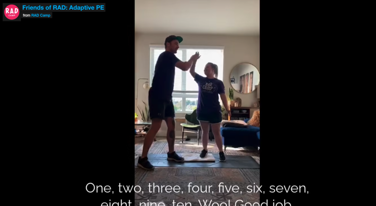 A brother and sister are high-fiving during a workout